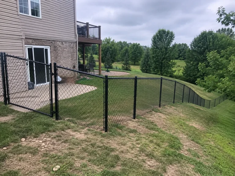 Marion, Iowa fence project showing black chain link backyard boundary fence