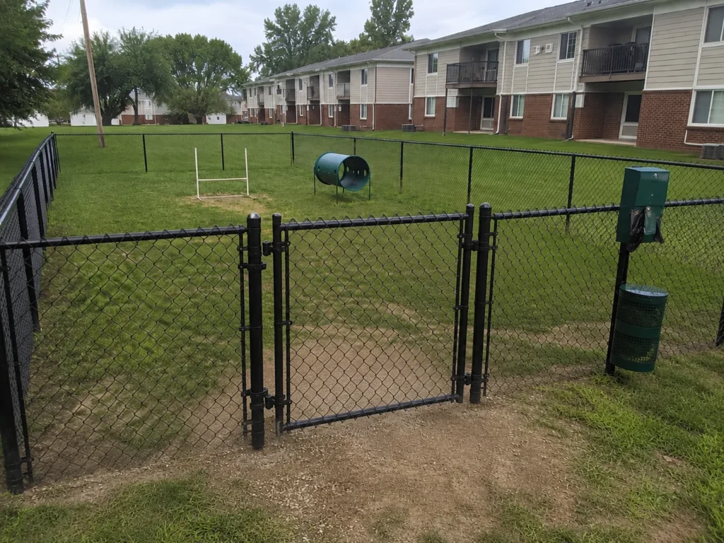 Residential black chain link backyard gate photographed in Center Point, Iowa