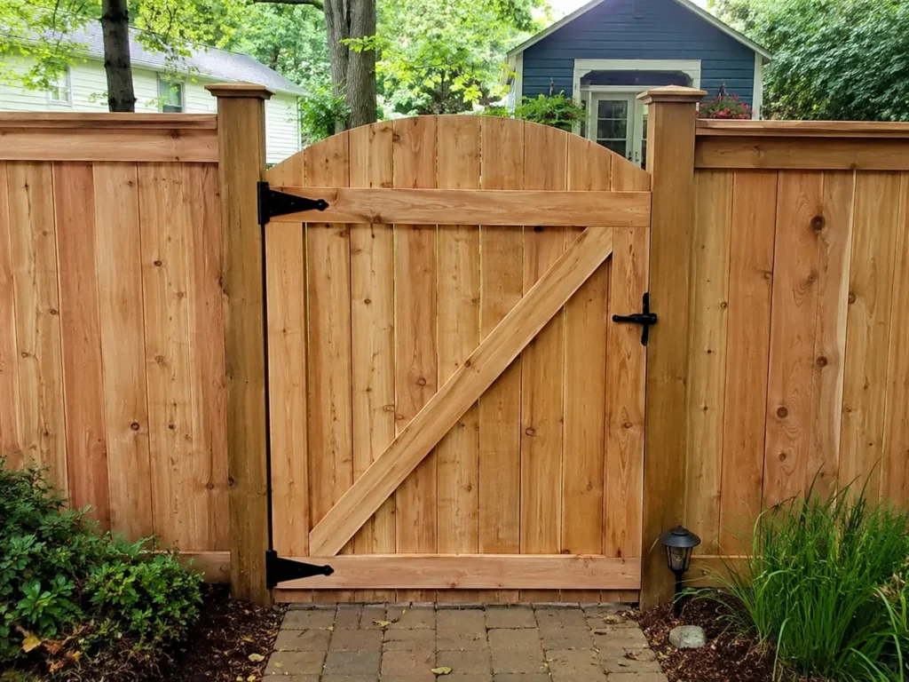 Residential cedar arched garden gate photographed in Cedar Rapids, Iowa