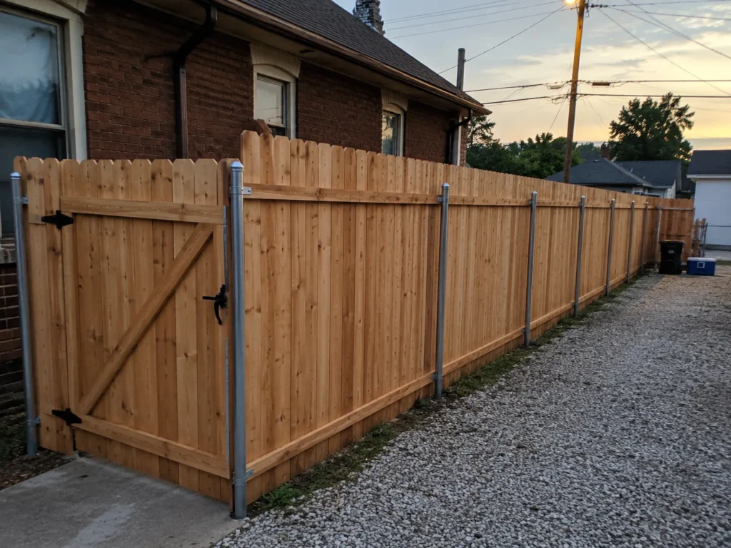 cedar privacy fence and driveway gate shown at a property in Cedar Rapids, Iowa