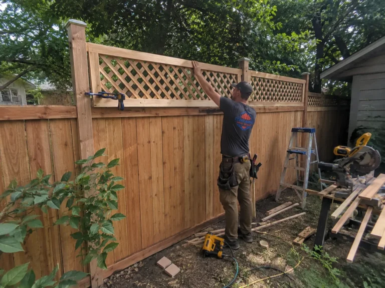 cedar privacy fence with lattice topper installation at an Eastern Iowa property in Marion