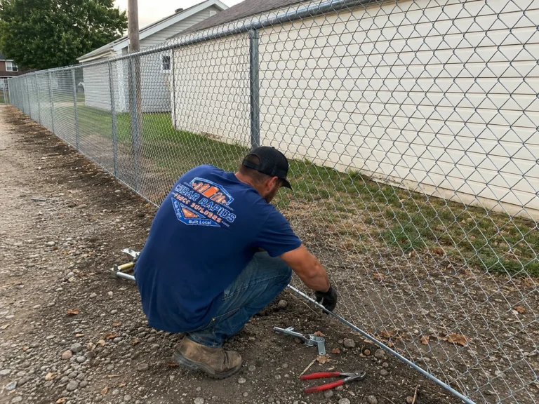 chain link fence installation at a commercial property shown at a property in Fairfax, Iowa