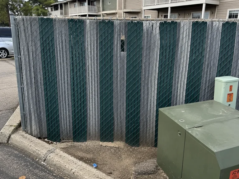 chain link privacy slats around utility equipment at an Eastern Iowa property in Cedar Rapids