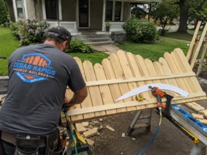 Residential custom wood picket gate construction photographed in Cedar Rapids, Iowa