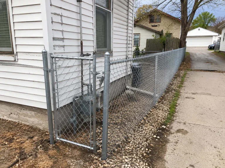 galvanized chain link residential side yard gate shown at a property in Marion, Iowa