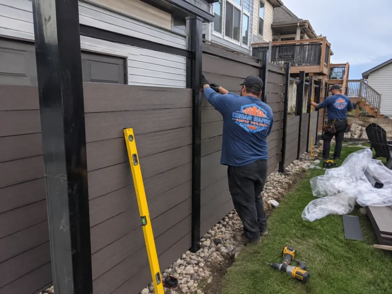 gray composite privacy fence installation at an Eastern Iowa property in Cedar Rapids