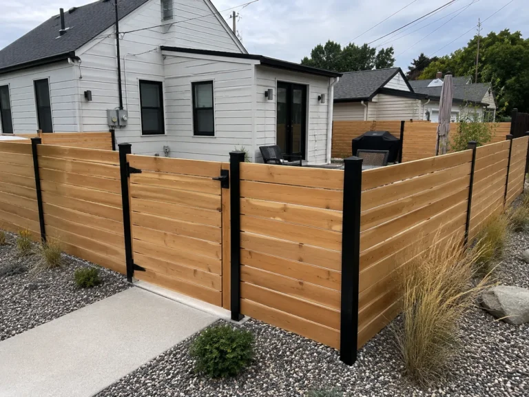 Cedar Rapids, Iowa view of horizontal cedar privacy fence corner with black posts