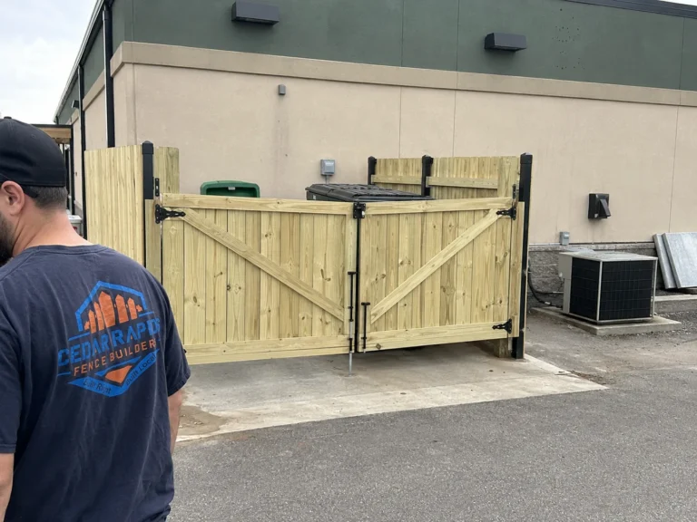 Residential natural wood double service gate photographed in Cedar Rapids, Iowa