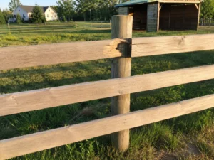 natural wood three rail ranch fence in Cedar Rapids, Iowa