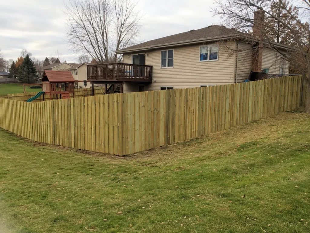 Close view of new vertical cedar privacy fence around a backyard in Cedar Rapids, Iowa