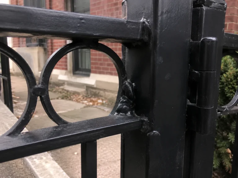 Detailed view of ornamental aluminum gate hinge detail in Cedar Rapids, Iowa