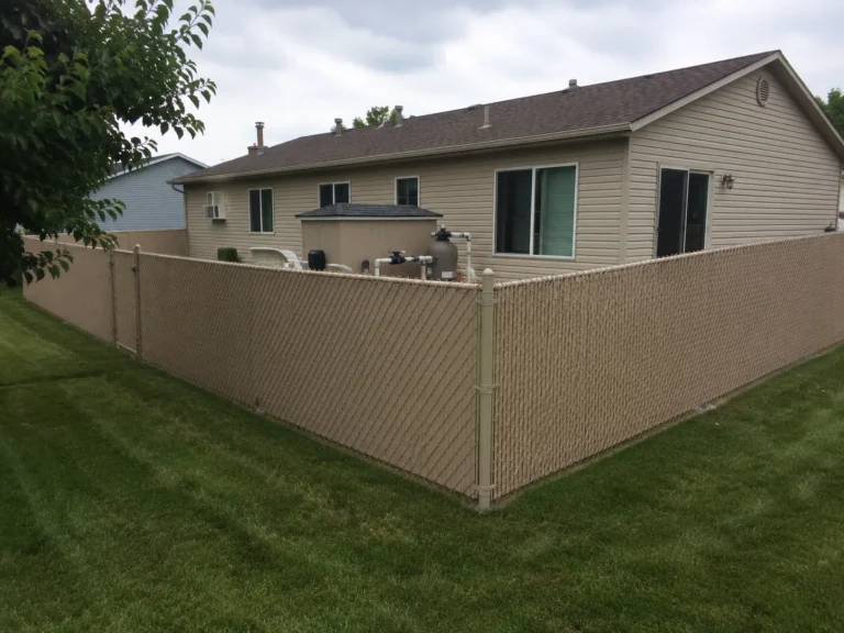 Close view of tan vinyl privacy fence corner in Cedar Rapids, Iowa