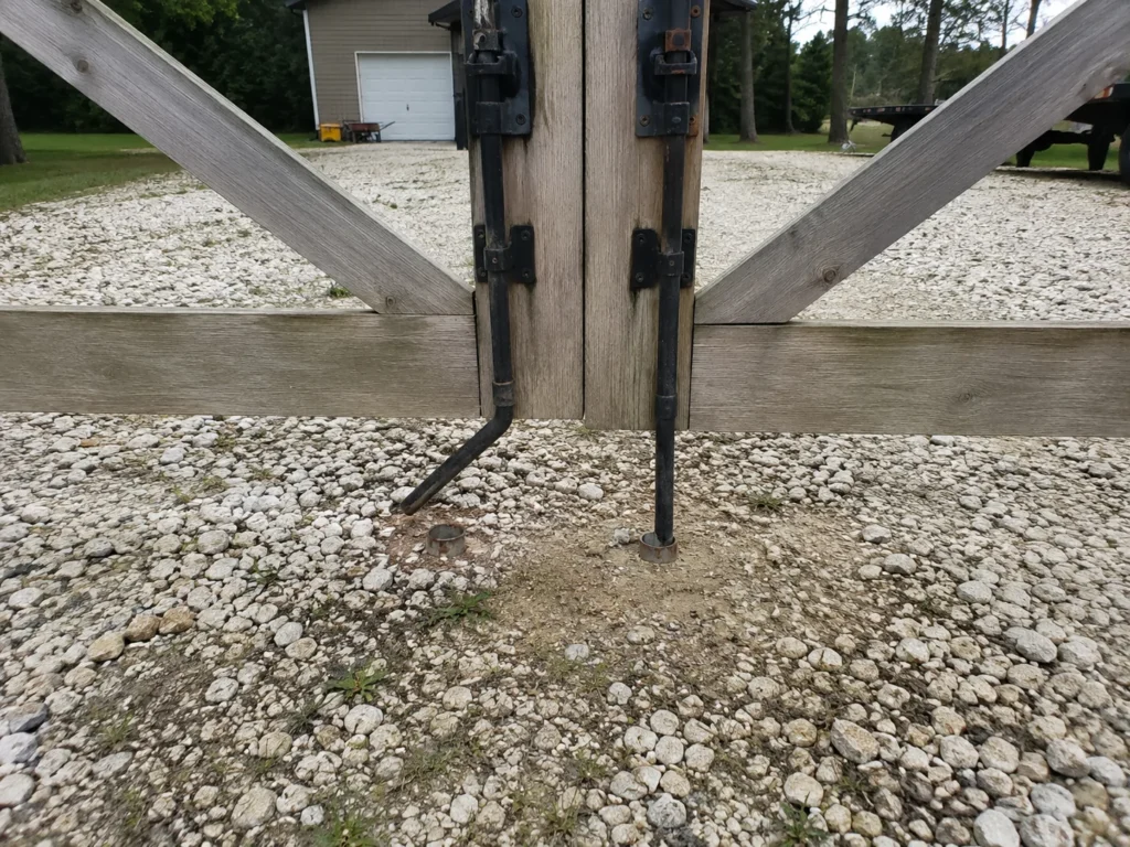 wood farm gate hinge and post hardware at an Eastern Iowa property in Mount Vernon
