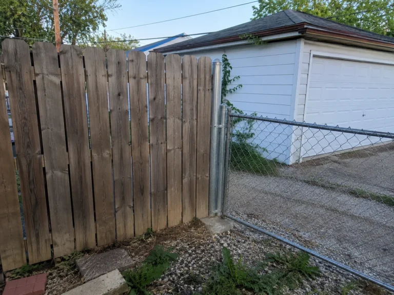 Cedar Rapids, Iowa view of wood privacy fence beside a chain link gate
