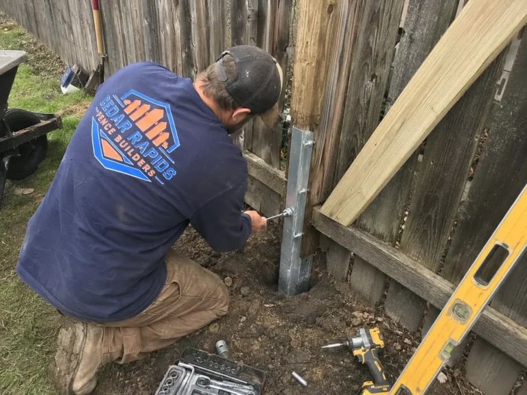 Residential wood privacy fence post and gate repair photographed in Cedar Rapids, Iowa